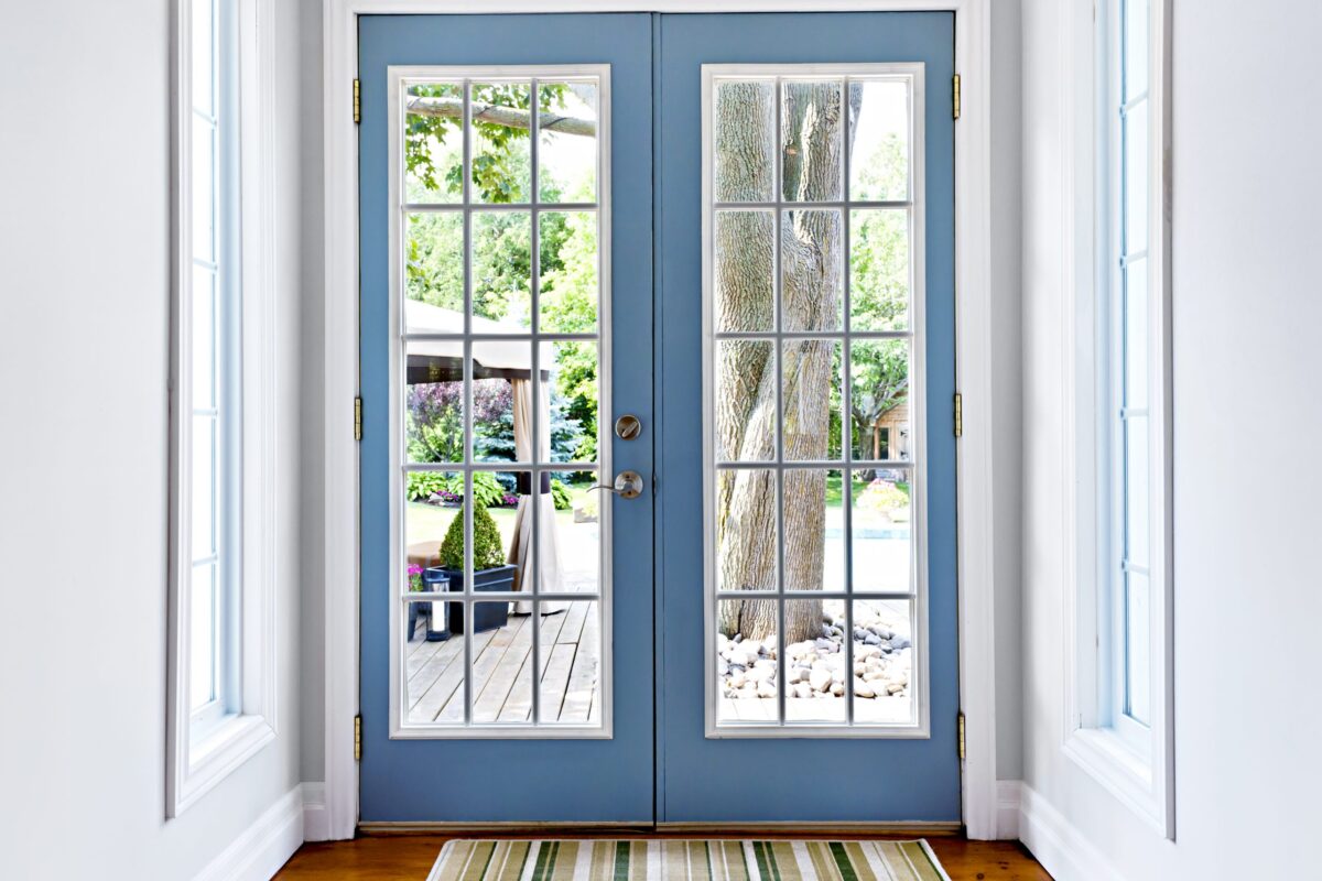 Double Patio French Doors With Windows Exiting To Sunny Backyard