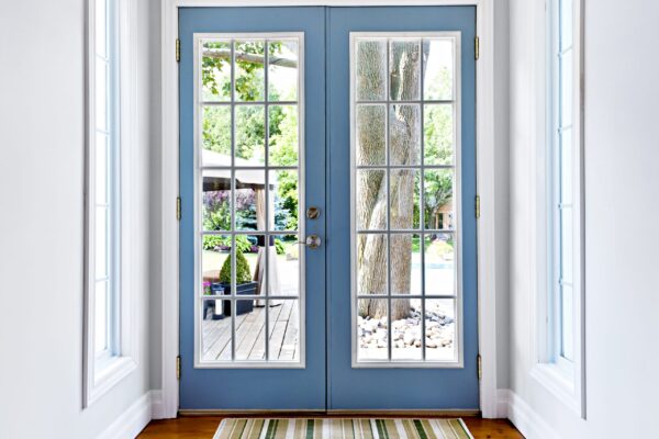 Double Patio French Doors With Windows Exiting To Sunny Backyard