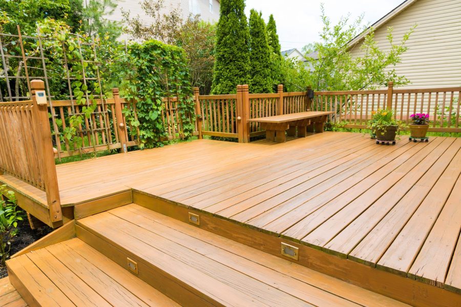 Wooden Deck Of Family Home At Summer.