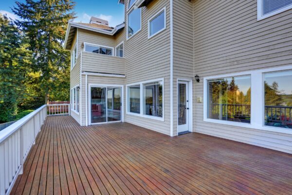 Two Story House With Wooden Walkout Deck Overlooking Backyard Ga