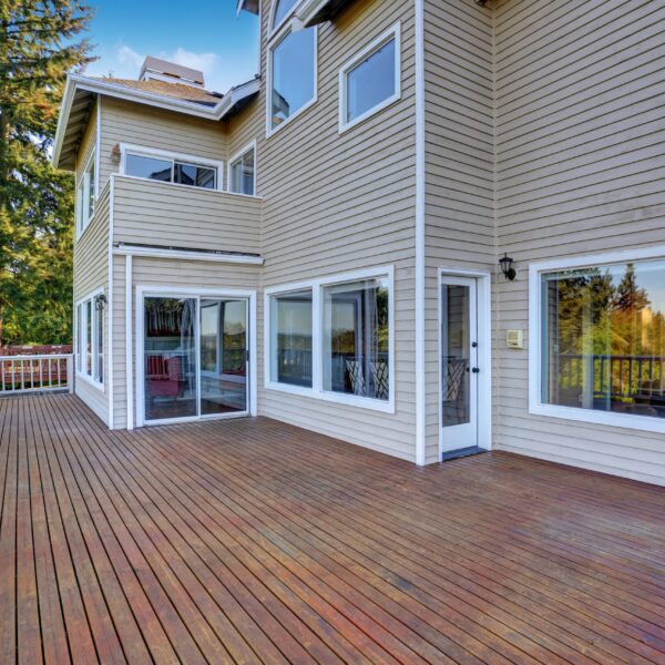 Two Story House With Wooden Walkout Deck Overlooking Backyard Ga